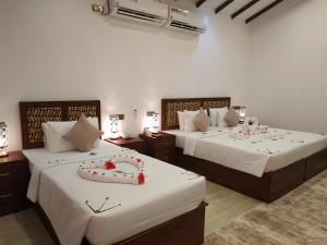 Voodi või voodid majutusasutuse Sigiriya Cashew Palace Resort toas