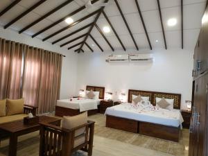 Voodi või voodid majutusasutuse Sigiriya Cashew Palace Resort toas