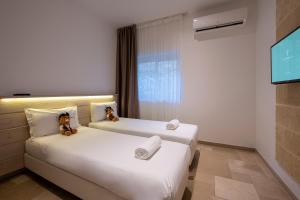 Voodi või voodid majutusasutuse Gattarella Family Resort Puglia - Standard Half-Board à buffet toas