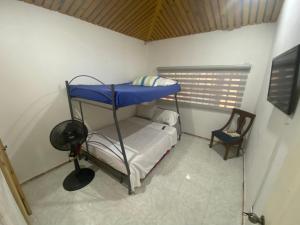 Postel nebo postele na pokoji v ubytování Casa de descanso acacias meta + 25 fotografií
