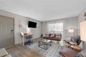 a living room with a couch and a table at Boho Chic 2bedroom walking distance to the Battery in Atlanta