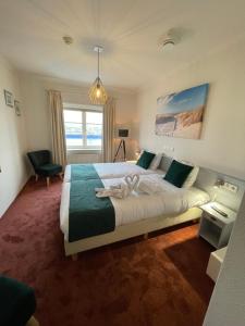 Postel nebo postele na pokoji v ubytování Havenhotel At Sea Texel