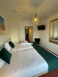Postel nebo postele na pokoji v ubytování Havenhotel At Sea Texel