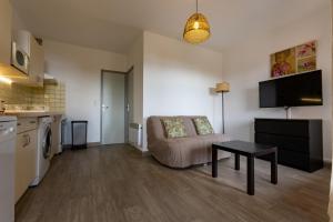 a living room with a couch and a table at La Punta Geronimi in Porto Pollo