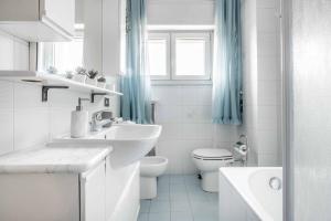 A bathroom at Morgantini House San Siro-Duomo "Netflix & Terrace"
