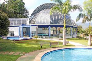 Πισίνα στο ή κοντά στο APT MODERNO À 60 METROS DO TERMAS