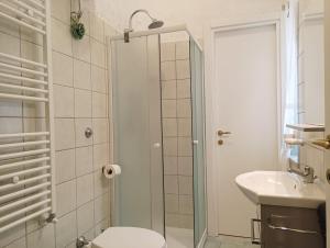 a bathroom with a shower and a toilet and a sink at B&B da Niky in Termoli