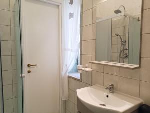 a bathroom with a sink and a mirror at B&B da Niky in Termoli +8 photos