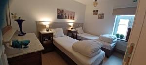 Postel nebo postele na pokoji v ubytování Charta Appartement