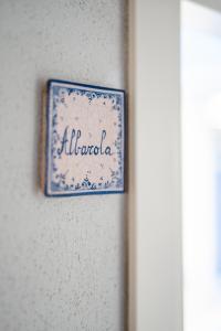 a blue and white plate hanging on a wall at Affittacamere Irene in Monterosso al Mare