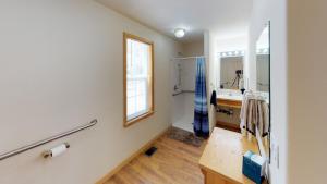 a bathroom with a sink and a mirror at Wiggins River Retreat 5 On The River in Red River +21 photos