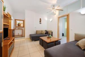 a living room with a couch and a table at Marina In Sight in Portimão