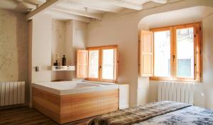 Posteľ alebo postele v izbe v ubytovaní Clauhomes Casa Rural Deluxe