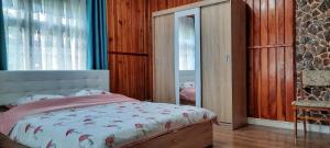 En eller flere senge i et værelse på Rivr House Bucovina
