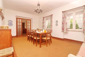 a dining room with a table and chairs at GRANDMA BAY HOUSE in São Martinho do Porto