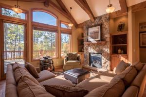 a living room with a couch and a fireplace at Lakefront Giants Ridge Retreat Near Ski and Golf! in Biwabik