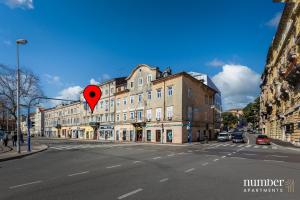 a red heart sign in the middle of a city street at Dream Fiumara Apartments in Rijeka