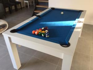 a pool table with balls on top of it at Villa St. Georges in La Rochelle