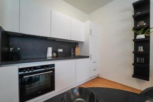 A kitchen or kitchenette at The View 1
