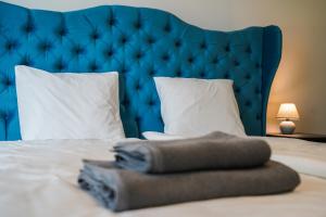 A bed or beds in a room at The View 1
