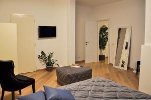 Televízia a/alebo spoločenská miestnosť v ubytovaní Flat with Jacuzzi - Casa Pia
