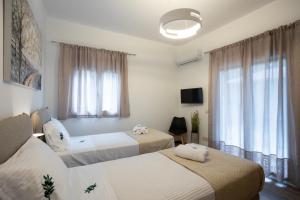 Ένα ή περισσότερα κρεβάτια σε δωμάτιο στο Anastasia's House