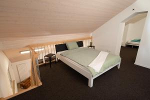 a bedroom with a large bed in a attic at Hotel Ochsen Rapperswil/BE in Rapperswil