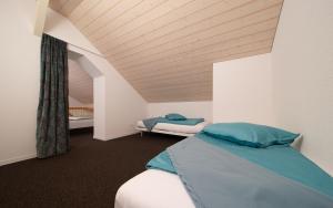 Postel nebo postele na pokoji v ubytování Hotel Ochsen Rapperswil/BE