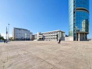 a large plaza in front of a large glass building at Spacious House in Porto for family and friends in Maia