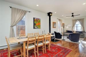 a dining room with a table and chairs and a living room at Cheerful, Spacious 3 Bdrm3 Bath, in Salida
