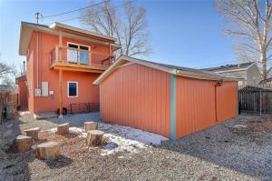 a orange house with a fence and a balcony at Cheerful, Spacious 3 Bdrm3 Bath, in Salida
