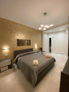 Posteľ alebo postele v izbe v ubytovaní B&B San Giuseppe, nel cuore di Ortigia