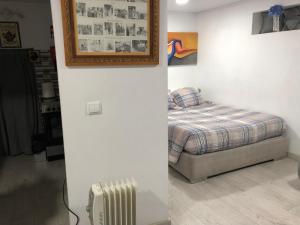 Cama ou camas em um quarto em Pé do Castelo Casinha - pet friendly & garage