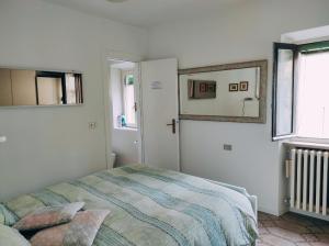 A bed or beds in a room at Maddalena House