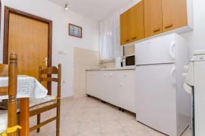 Kuchyň nebo kuchyňský kout v ubytování Apartments Kursan