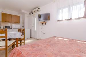 Postel nebo postele na pokoji v ubytování Apartments Kursan