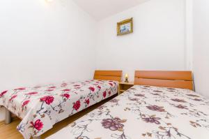 Postel nebo postele na pokoji v ubytování Apartments Kursan