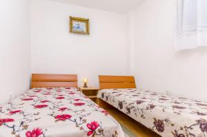 Postel nebo postele na pokoji v ubytování Apartments Kursan