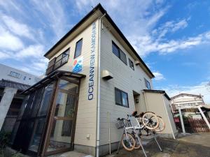 a building with a sign on the side of it at Ocean View Kamogawa - Vacation STAY 61073v in Kamogawa