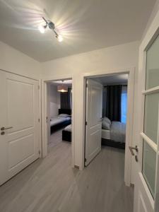 a room with two beds and a ceiling fan at Apartment Brussels Airport and NATO OTAN headquarters in Machelen