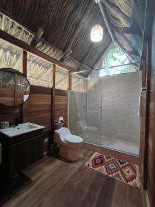 a bathroom with a shower and a toilet and a sink at Salvia Madre in Santa Marta