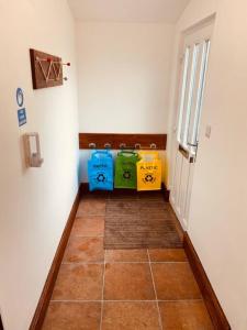 a hallway with shopping bags in a room at Luxury 2 bed apt 4 mins from M6 J44 pet friendly, in Carlisle