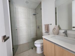 a bathroom with a toilet and a sink and a shower at Aria Ocean mountain 715B QueridaEstancia in Bucerías