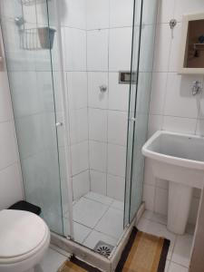a bathroom with a shower and a toilet and a sink at Moradinha da Lapa in Rio de Janeiro