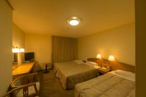 Voodi või voodid majutusasutuse Sky Hotel Uozu Annex toas