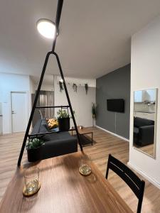 a living room with a table and a couch at mamila apartment in Jerusalem