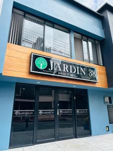 a building with a sign for a jardinian hotel at HOTEL JARDIN 38 in Pasto