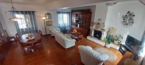 an aerial view of a living room with a fireplace at Vivenda Malaquias in Santo André