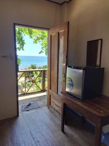 TV a/nebo společenská místnost v ubytování Paseo Del Mar Seaside Inn
