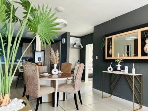 a dining room with a table and chairs at D&DLuxury Rivonia Apartments with inverter in Johannesburg